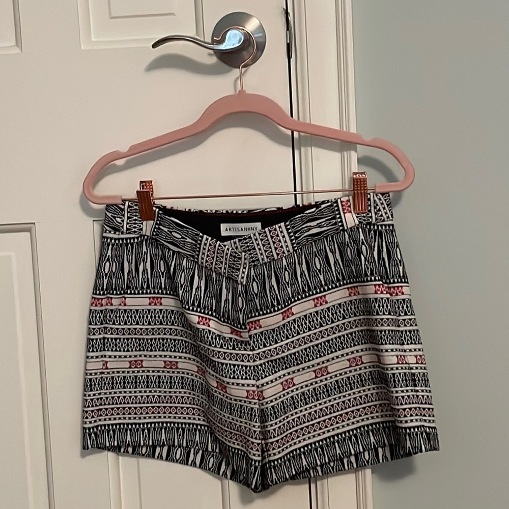 Pink, black, and cream colored shorts